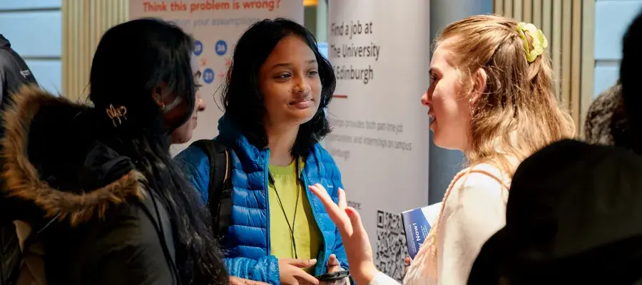 Students talking to university staff