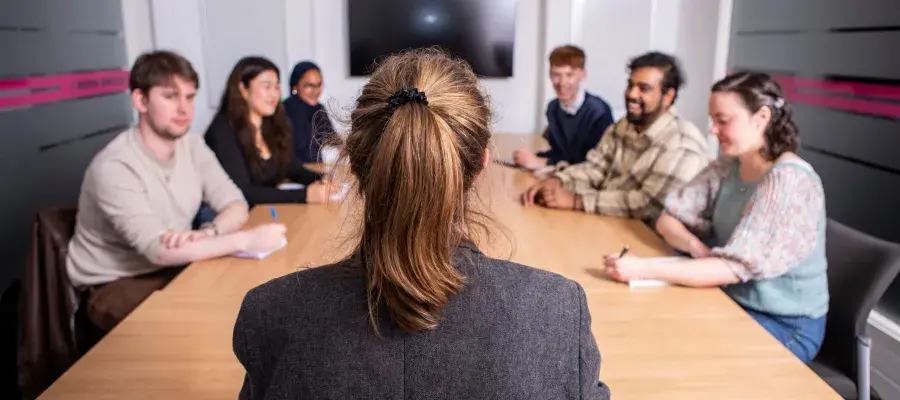 Applicants sitting around table