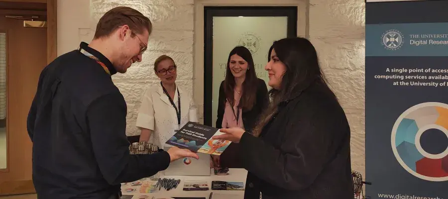 Students talking to university staff
