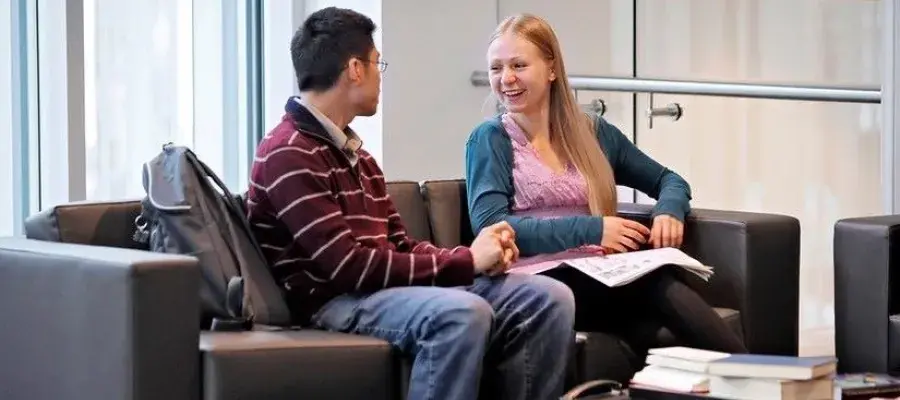 Image of two students meeting 
