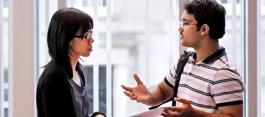 Students talking to university staff