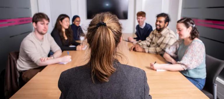 Applicants sitting around table