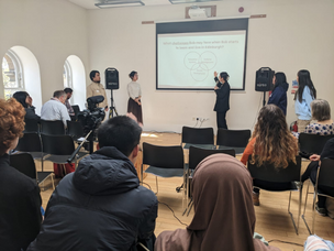 Students presenting their ideas to university staff and students at the final event.
